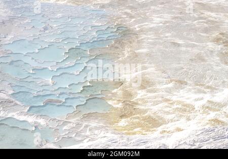 Texture with abstract pattern in pastel colors. Pamukkale calcium travertine in Turkey, top view. Stock Photo