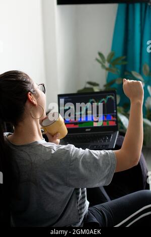 Stock market and investing concept with trader working on laptop.  Stock Photo