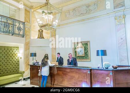 London England,West End City Westminster Mayfair,Park Lane,The Dorchester hotel 5-star,lobby front reservations check-in desk woman female guest Stock Photo