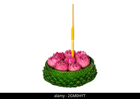 Banana leaf Krathong that have 3 incense sticks and candle decorates with pink lotus flowers for Thailand full moon or Loy Krathong festival isolated Stock Photo