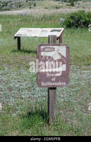 Madison Buffalo Jump SP , MT, USA - July 2, 2020: A warning sign in case of snake sighting Stock Photo