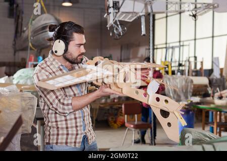 Male creating airplane models Stock Photo