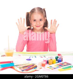 The child, a little girl draws paints isolated on white background Stock Photo