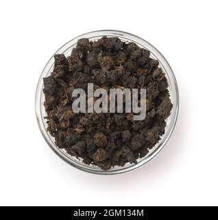 Top view of granular black tea in glass bowl isolated on white Stock Photo