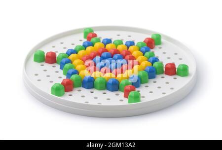 Colorful plastic mosaic puzzle isolated on white Stock Photo