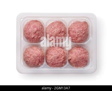 Top view of fresh raw turkey meatballs in plastic disposable tray isolated on white Stock Photo