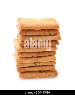 Front view of stacked salted crackers with rosemary isolated on white Stock Photo