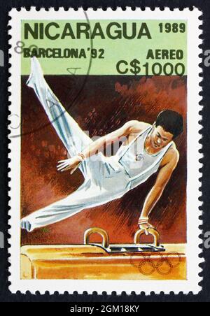 NICARAGUA - CIRCA 1989: a stamp printed in Nicaragua shows Pommel Horse, Gymnastics, 1992 Summer Olympics, Barcelona, Spain, circa 1989 Stock Photo