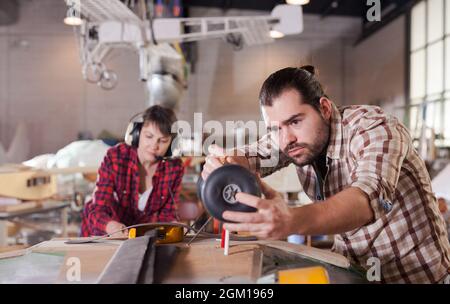 Male creating airplane models Stock Photo