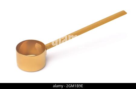 Empty golden coffee measuring spoon isolated on white Stock Photo