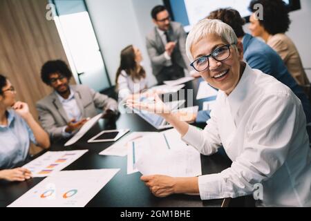 Portrait of successful business team working in office Stock Photo