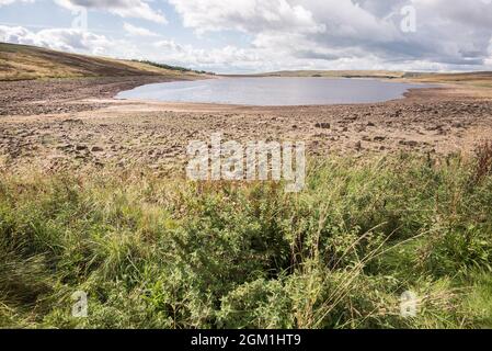 Exposed margins as water levels drop at Grimwith reservoir near Grassington in North Yorkshire Stock Photo