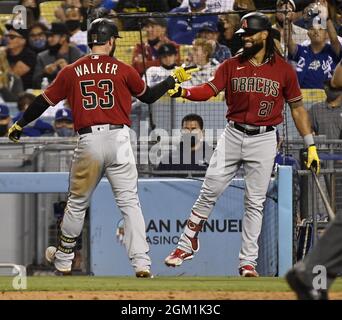 Los Angeles, United States. 15th Sep, 2021. Arizona Diamondbacks' Christian Walker (53) celebrates with teammate Henry Ramos (21) after hitting a solo home run off Dodgers' reliever Phil Bickford in the sixth inning at Dodger Stadium in Los Angeles on Wednesday, September 15, 2021. Photo by Jim Ruymen/UPI Credit: UPI/Alamy Live News Stock Photo