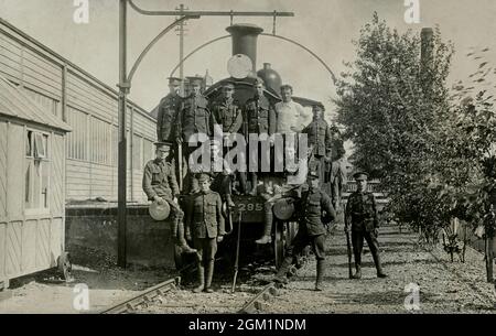 British soldiers from the Corps of Royal Engineers stand on a steam locomotive, during or soon after the First World War Stock Photo