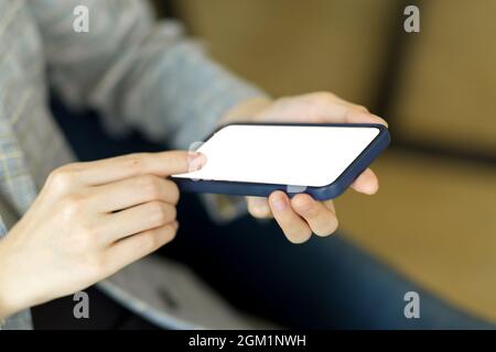 Closeup, Female hold smartphone text message online. smart mobile phone blank screen mockup. internet device technology concept Stock Photo
