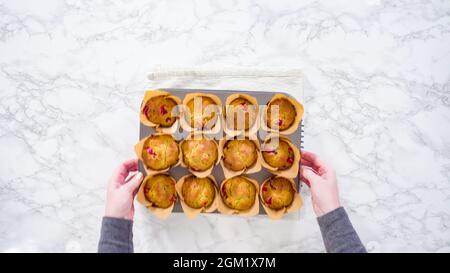 Flat lay. Step by step. Cooling freshly baked cranberry muffins. Stock Photo