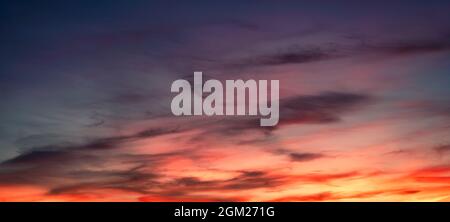 Colorful sky with clouds at sunset. Dramatic evening sky. Natural background Stock Photo