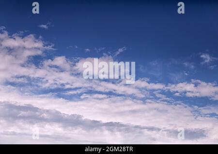 Light white clouds on a blue sky on a summer day Stock Photo