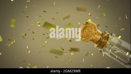 Image of gold confetti falling over champagne being opened Stock Photo