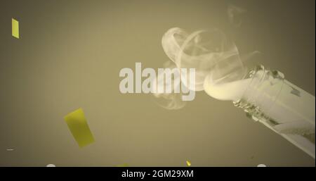 Image of gold confetti falling over champagne being opened Stock Photo