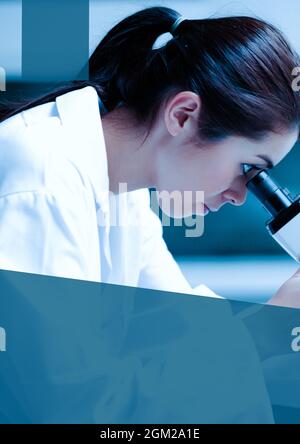 Blue banner with copy space against female health worker using microscope at laboratory Stock Photo