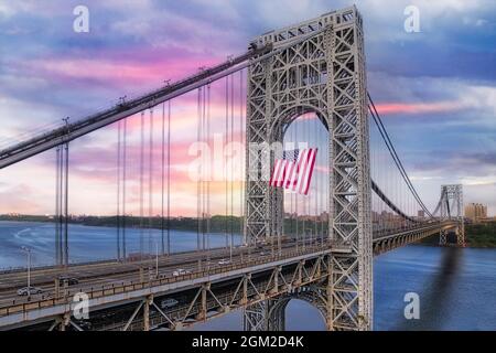 George Washington Bridge USA GWB III  - View of the New Jersey NJ side stanchion with the worlds largest free flying American flag.   The GW is also r Stock Photo