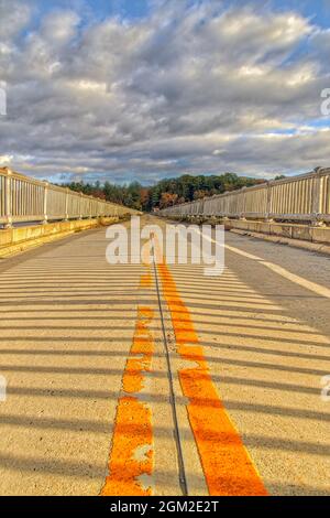 New Croton On The Hudson Dam - View of te Croton Dam bridge also known as the Cornell Dam during a beautiful autumn afternoon. The golden warm hues of Stock Photo