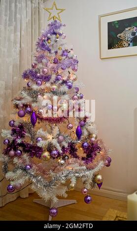 Mardi Gras Christmas tree decorated with purple (justice), green