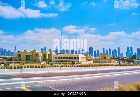 The picturesque futuristic skyline of Dubai with glass skyscrapers of Downtown with Burj Khalifa in the middle, view from Jumeirah Beach Road, Dubai, Stock Photo