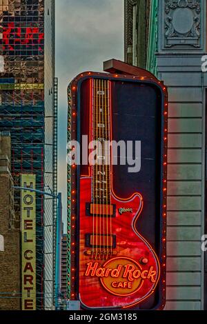 Hard Rock Cafe NYC - Illuminated guitar logo outside of the Times Square location in midtown Manhattan in New York City.  This image is available in c Stock Photo