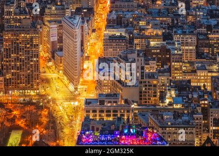 NYC Flatiron Building District- View from above of the triangular lower Manhattan landmark of the Flatiron Building in New York City during twilight. Stock Photo