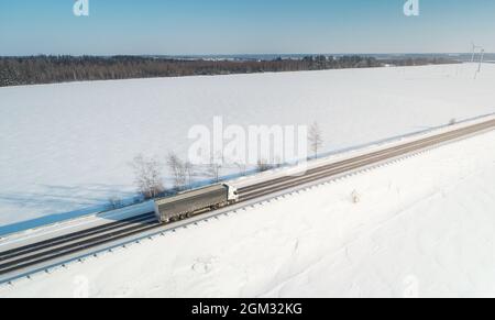 One truck car carry load on winter snow background aerial view Stock Photo