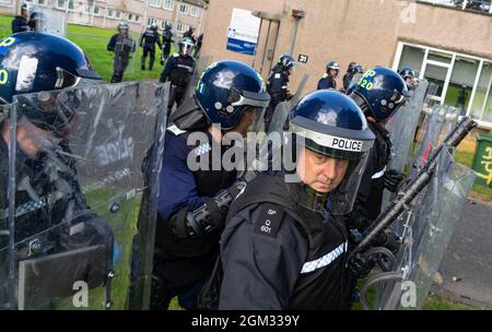 South Queensferry,, Scotland, UK. 16th September 2021. Police Scotland invite the press to witness their ongoing public order training at Craigiehall Camp at South Queensferry. The training is designed to prepare police for the upcoming COP26 event in Glasgow in November where protests are anticipated. Police in riot gear faced up  against police taking the role of protesters throwing missiles and attacking them with clubs.  Iain Masterton/Alamy Live News. Stock Photo