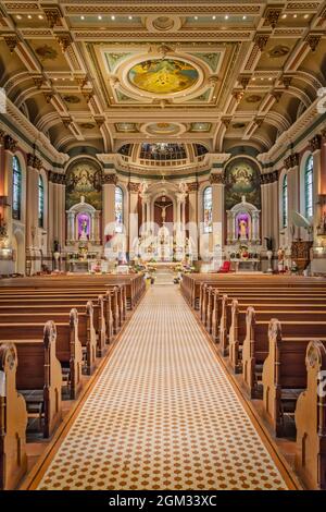 St Peter the Apostle Church PA - A view to the nave, altar of the Romanesque Revival architecture style church in Philadelphia, Pennsylvania.  St Pete Stock Photo