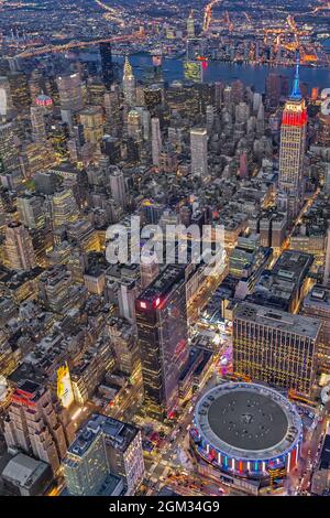 September 11 Aerial NYC Tribute - NYC Red White and Blue - Aerial view of the Empire State Building (ESB), Madison Square Garden (MSG), the Chrysler b Stock Photo