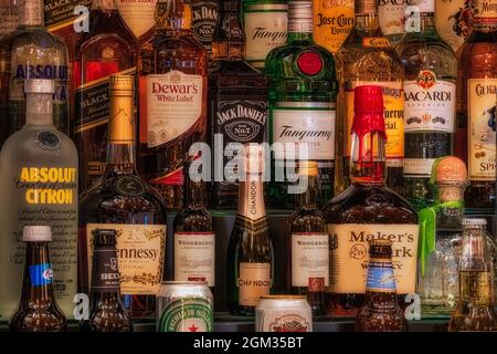 Bottoms Up - A variety of bottles alcholic beverages in a bar.  This image is available in color as well as black and white.   To view additional imag Stock Photo