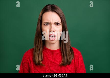 Photo portrait girl wearing knitted pullover got bad mood shocked isolated green color background Stock Photo