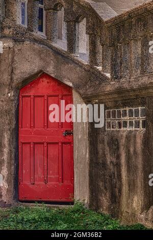 Red Door - Vibrant red door in a Doysletown, Pennsylvania castle's exterior.  This image is also available as a black and white.   To view additional Stock Photo