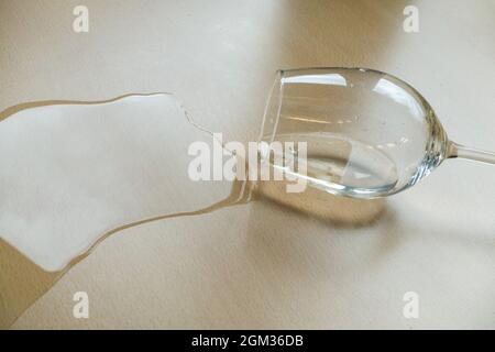 Wine glass and spilled liquid Stock Photo