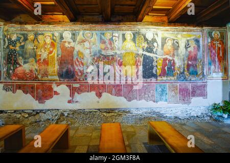 The north wall in St Bernardo Romanesque Church present painting dating to 1427, which represent allegories of the months of the year, the adoration b Stock Photo
