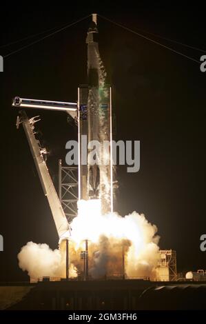 A SpaceX Falcon 9 rocket boosts the Crew Dragon spacecraft on the Inspiration4 mission from Complex 39A at 8:02PM at the Kennedy Space Center, Florida on Wednesday September 15, 2021. Crew Dragon will carry four civilians on a three day journey to space. Inspiration4 was created by Jared Isaacman to raise money for the St Jude Children's Research Hospital. Photo by Joe Marino/UPI Credit: UPI/Alamy Live News Stock Photo