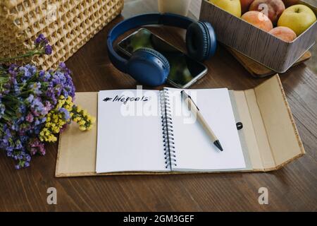 New Years Resolutions Goals motivational phrase in open notebook on the table. Outdoor still life with My Goals motivational text. Self-development Stock Photo
