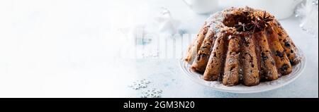 Traditional Christmas fruit cake, pudding on white plate. Top view. Copy space. Stock Photo