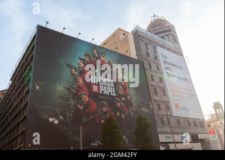 Madrid, Spain; 5th September: Facade poster advertising the fifth part of the famous series La Casa de Papel, in the building of the old Avenida cinem Stock Photo