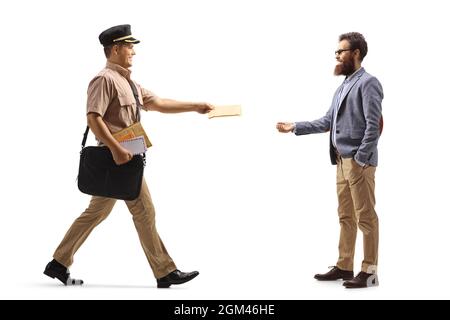 Full length profile shot of a postman delivering letter to a bearded man isolated on white background Stock Photo