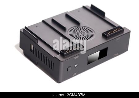 Drone battery charger hub with digital display isolated on white. Stock Photo