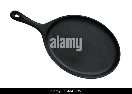 Oval cast iron pan for frying and serving dishes isolated on white background Stock Photo