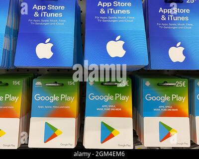 https://l450v.alamy.com/450v/2gm4em6/viersen-germany-june-9-2021-closeup-of-apple-app-store-itunes-and-google-play-voucher-gift-cards-in-a-row-in-shelf-of-german-shop-focus-on-cente-2gm4em6.jpg