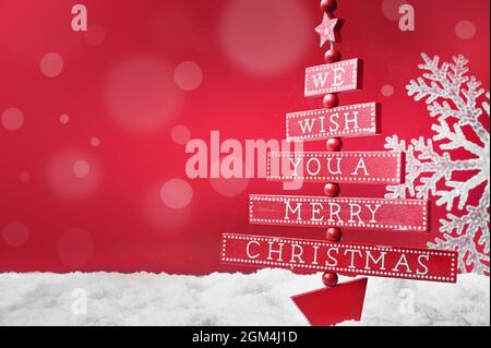Snowflake and Christmas tree on snow,Christmas decoration. Christmas background. Stock Photo
