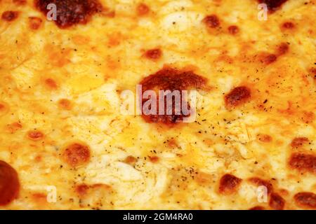 four cheeses pizza, or Pizza quattro formaggi, baked with cheeses melted Stock Photo